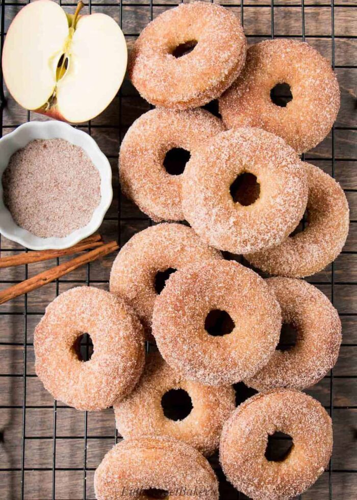 Apple cider donuts on a cooling rack.