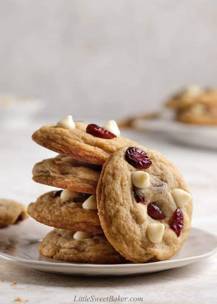 A stack os white chocolate cranberry cookies on a small plate.