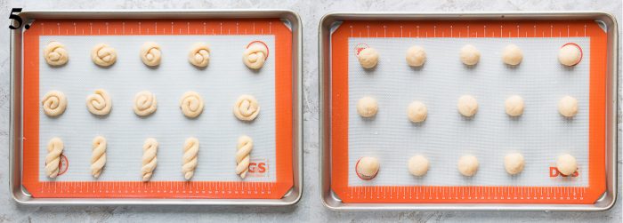Raw Italian Easter cookies on cookie sheets lined with silicone mats.
