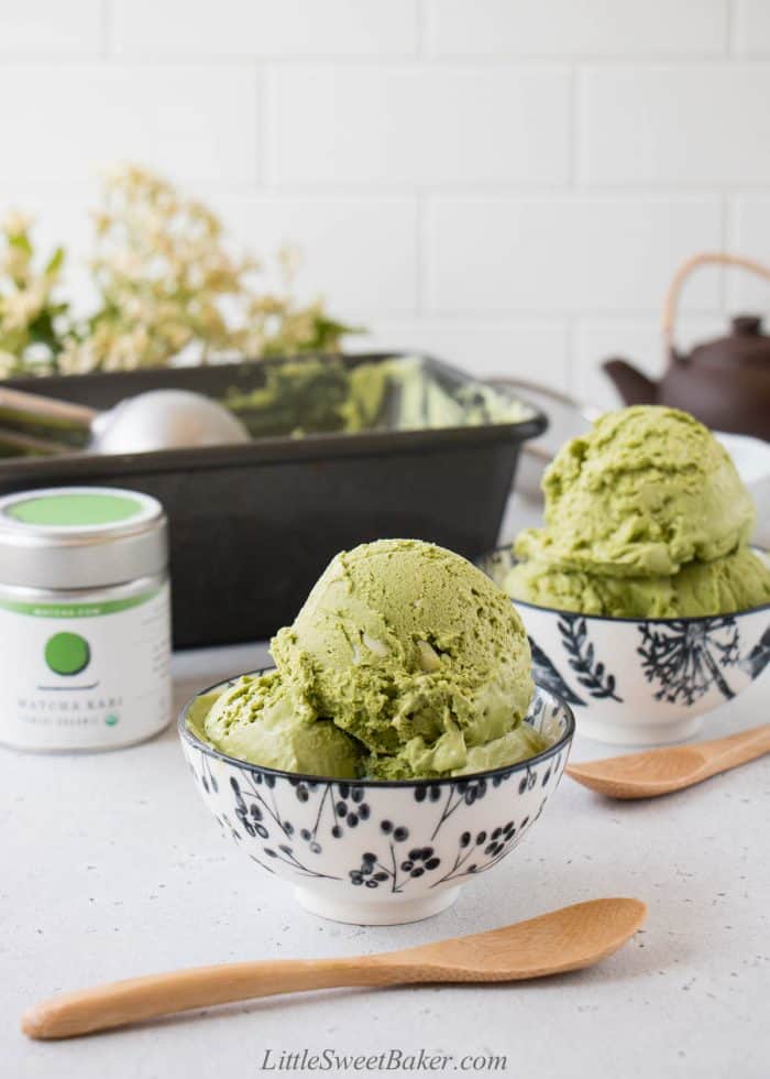 Two bowls of matcha ice cream with white chocolate.