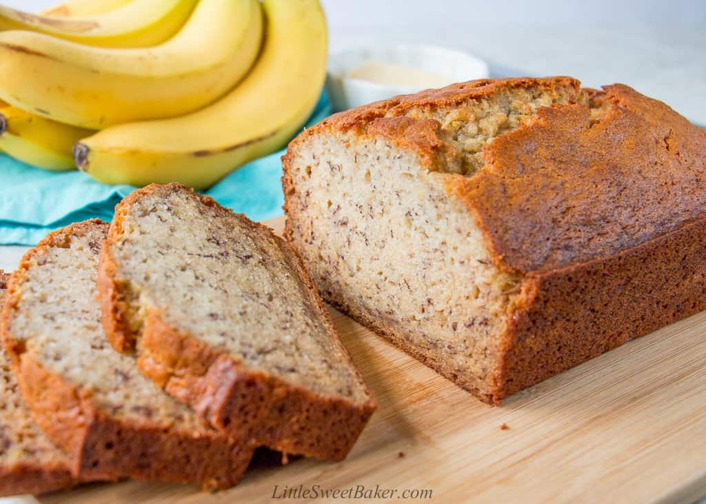 A loaf of banana bread on a cutting board.