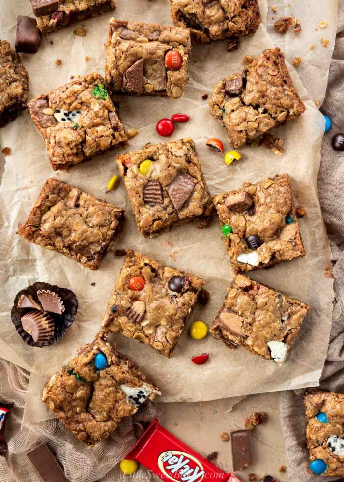 Halloween candy cookie bars on brown parchment paper and brown chiffon