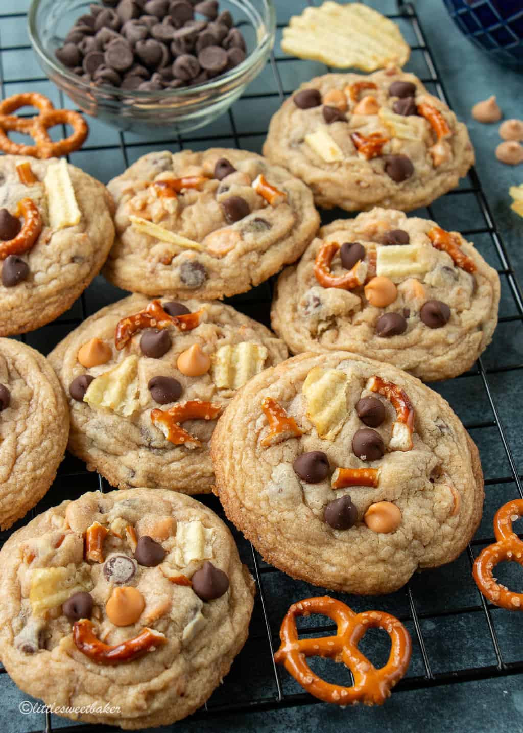 Kitchen sink cookies overlapping on a cooling rack.