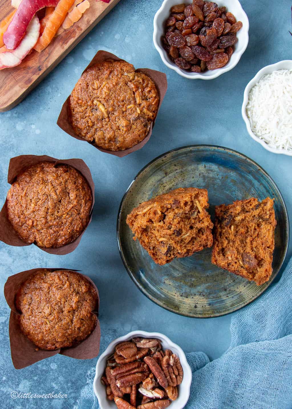 morning glory muffins on a blue backdrop with one a plate