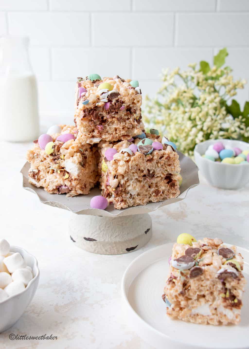Easter Rice Krispie Treats with mini eggs on a cake metal stand