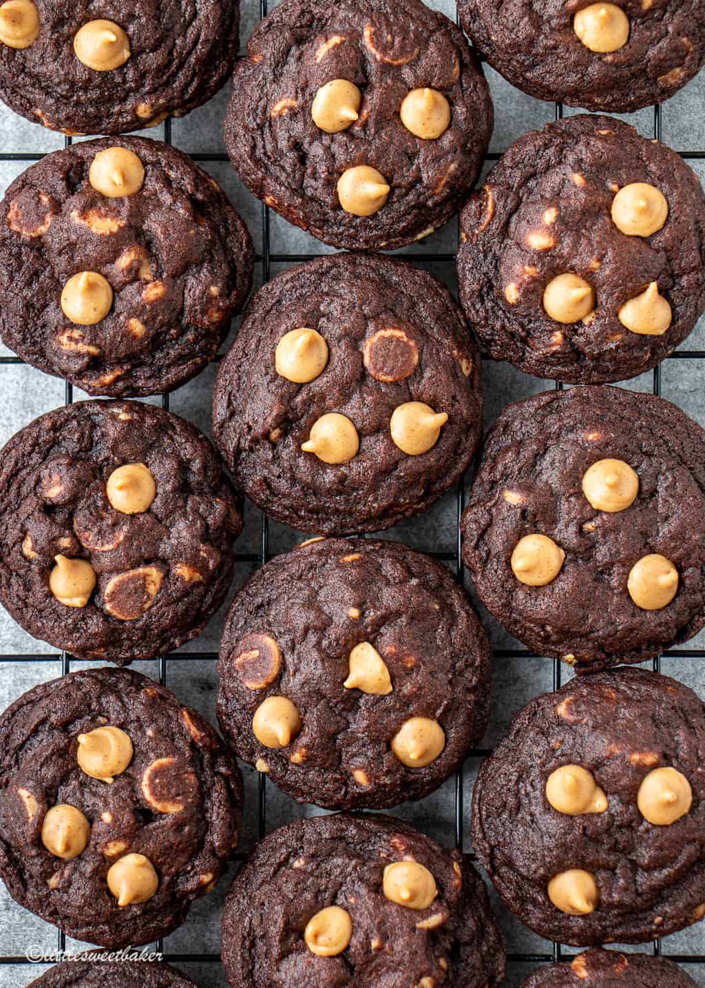 Chocolate peanut butter chip cookies on a cooling rack.