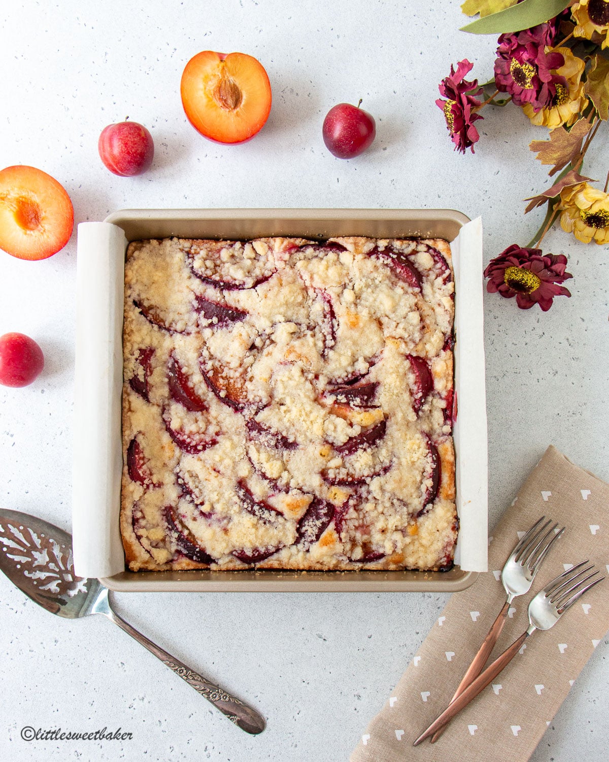 German plum cake on a square baking pan.