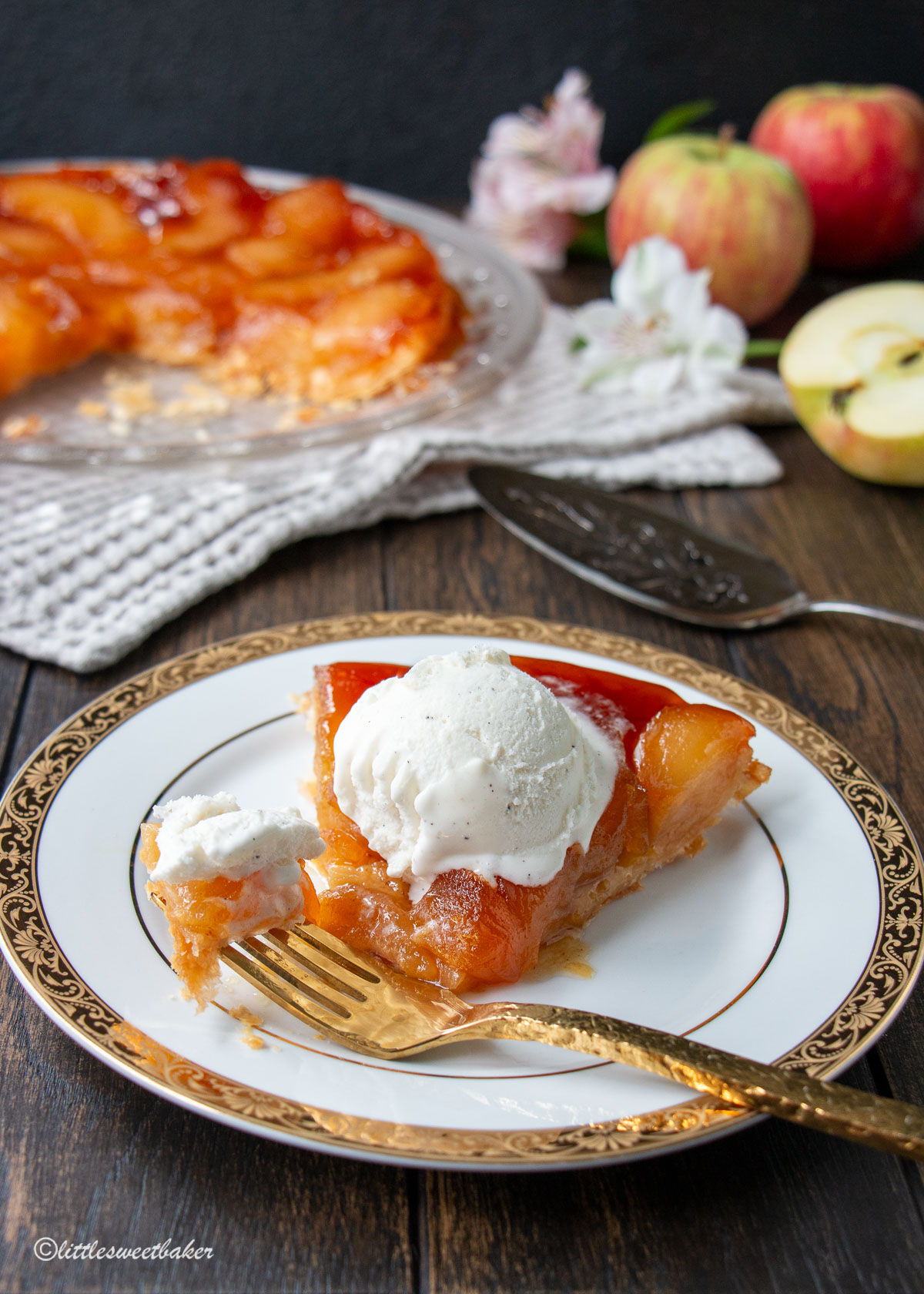 A slice of apple tarte tatin with a piece on a fork