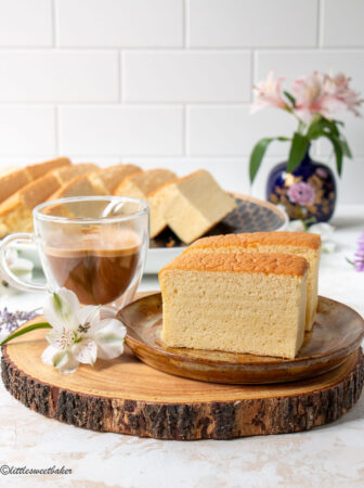 two pieces of Taiwanese castella cake on a plate and a cup of coffee