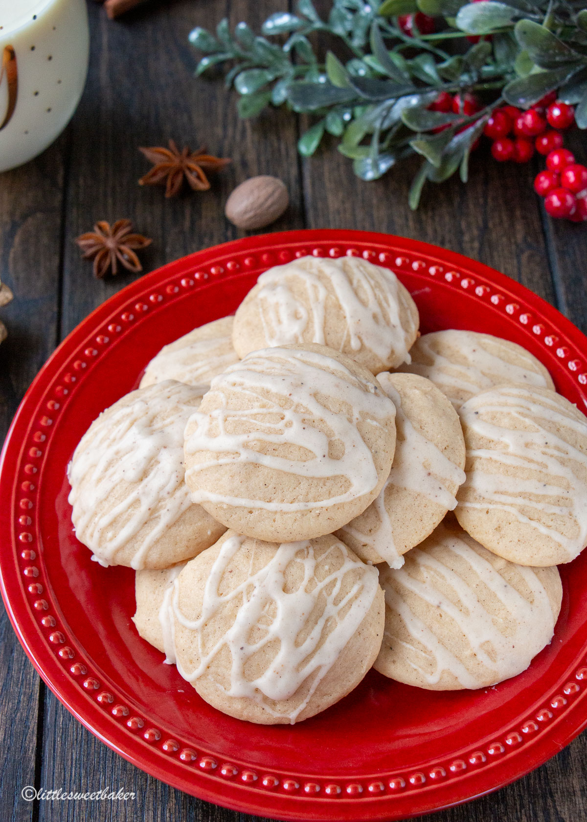 A red plate of glazed eggnog cookies