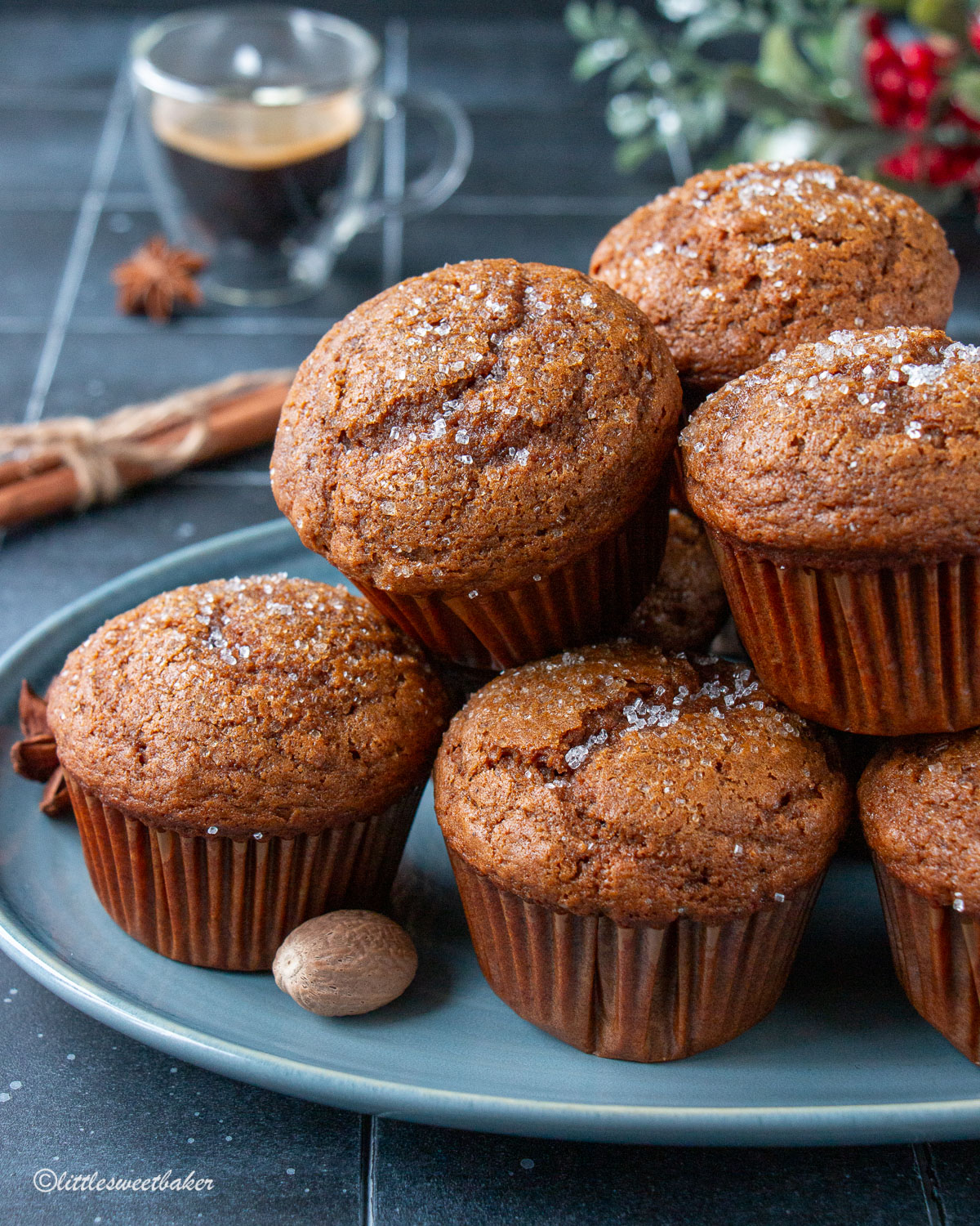 Gingerbread muffins piled on a blue serving plate.