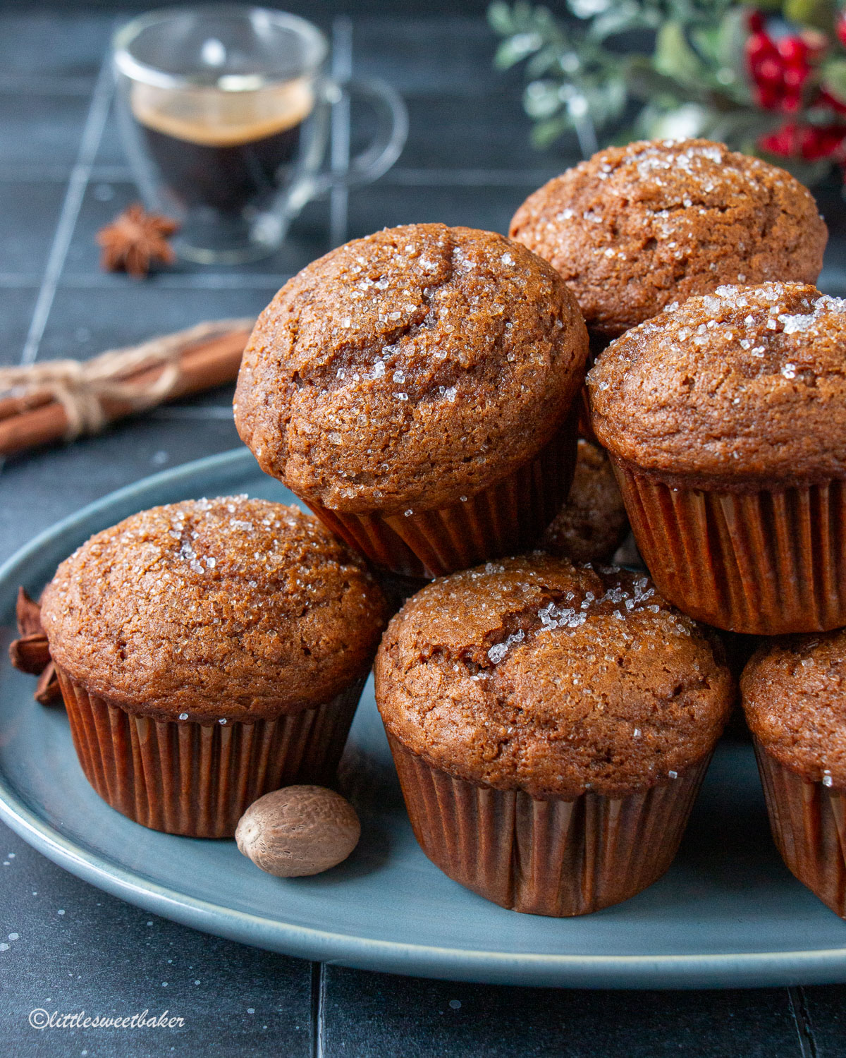 Gingerbread muffins piled on a blue serving plate.