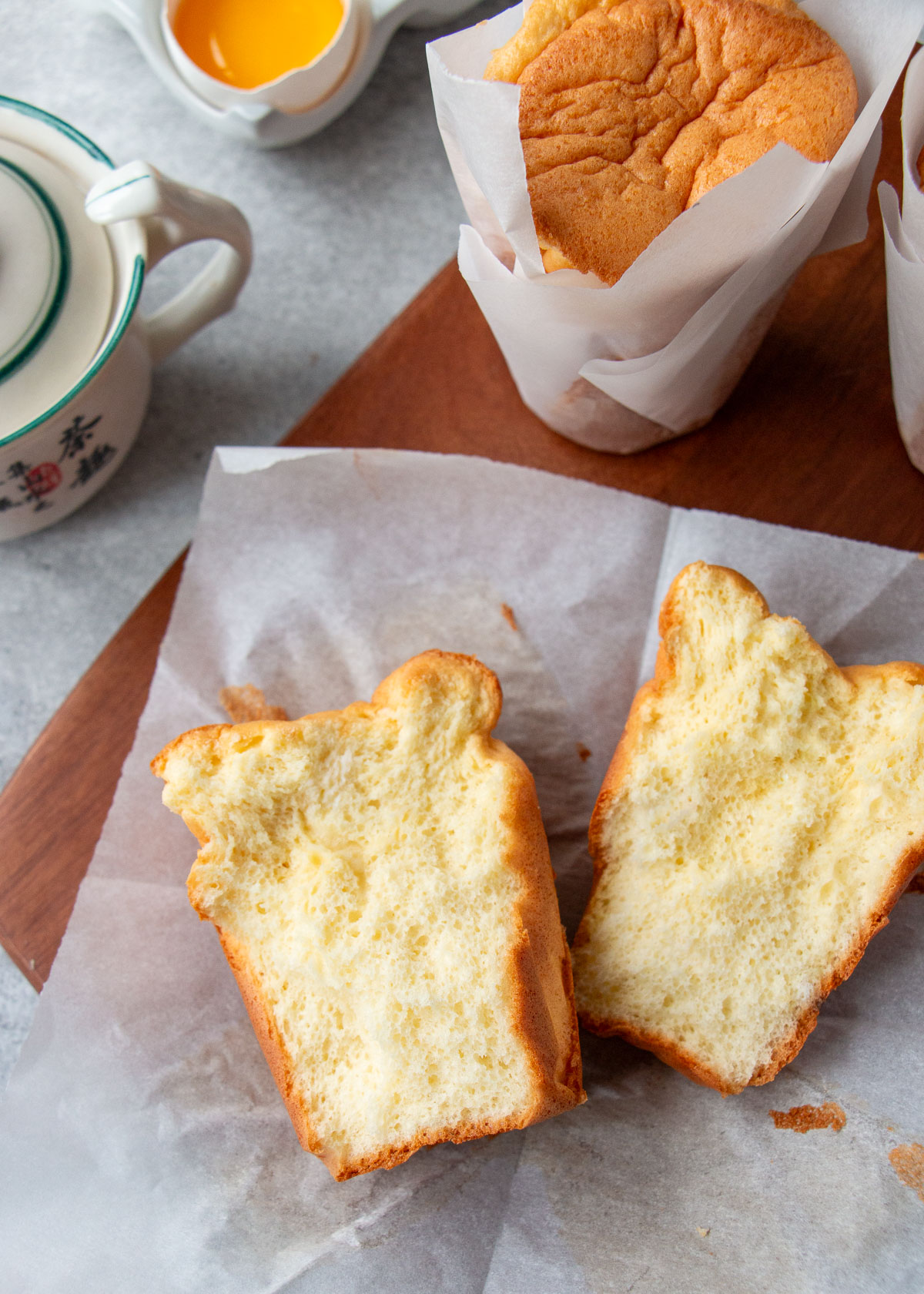 close up of a paper-wrapped sponge cake teared in half