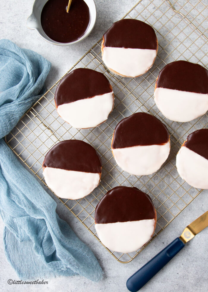 black and white cookies on a gold cooling rack