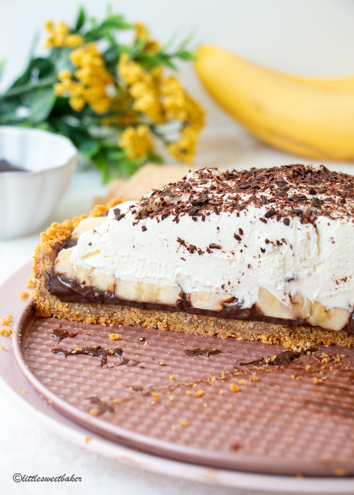a chocolate banoffee pie cut open to show what's inside