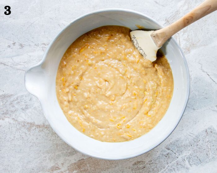 A mixing bowl of lemon zucchini cake batter.