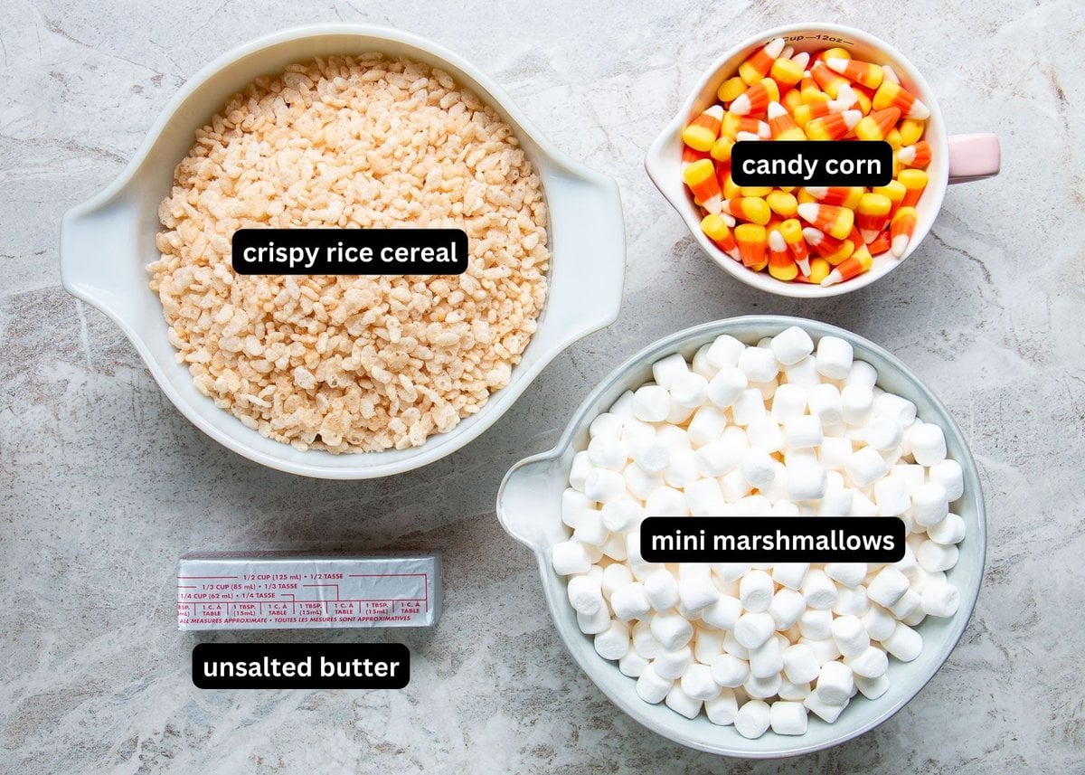 A photo of labelled ingredients needed to make candy corn rice krispie treats.