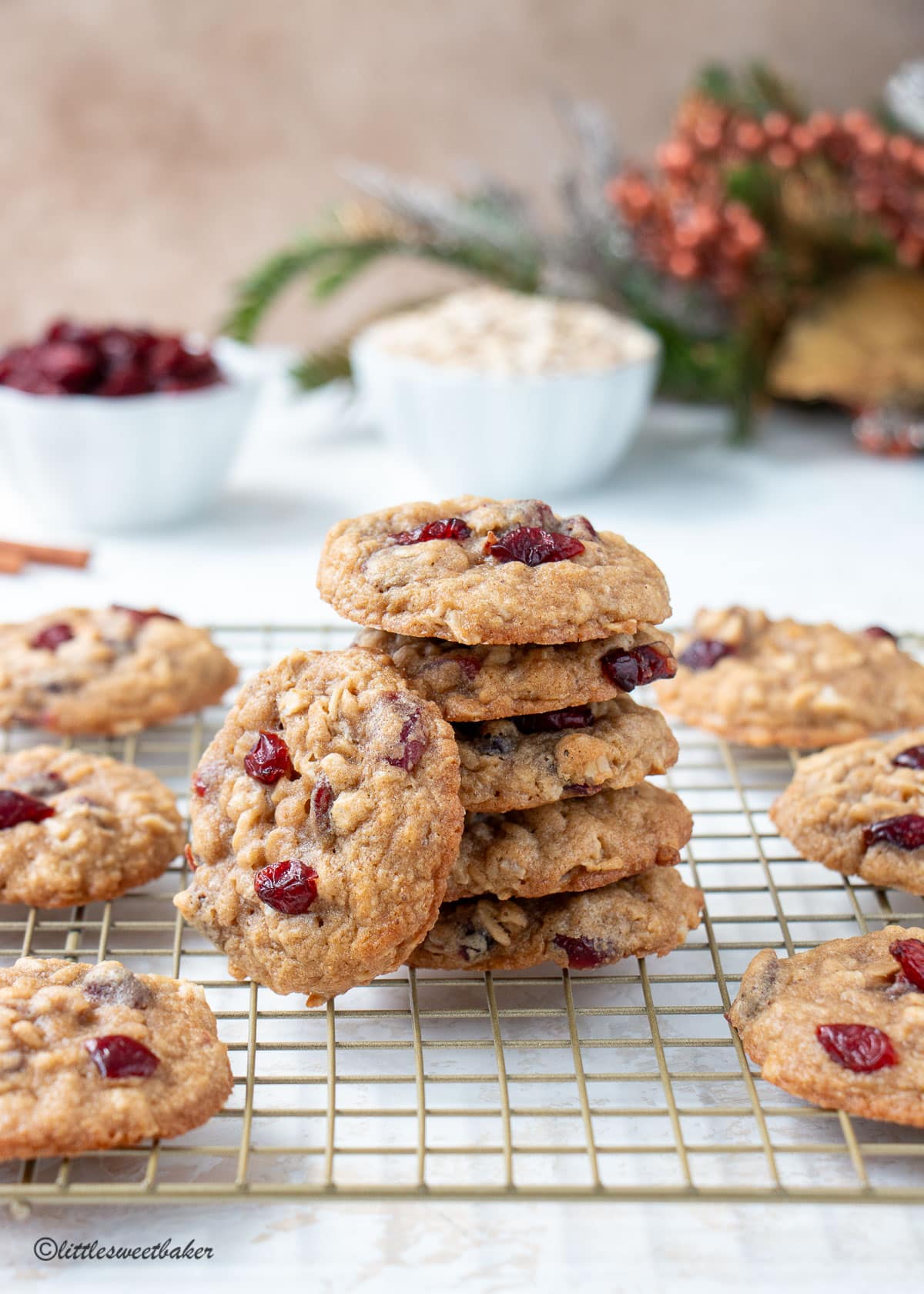 A stack of cranberry oatmeal cookies on a cooling rack.
