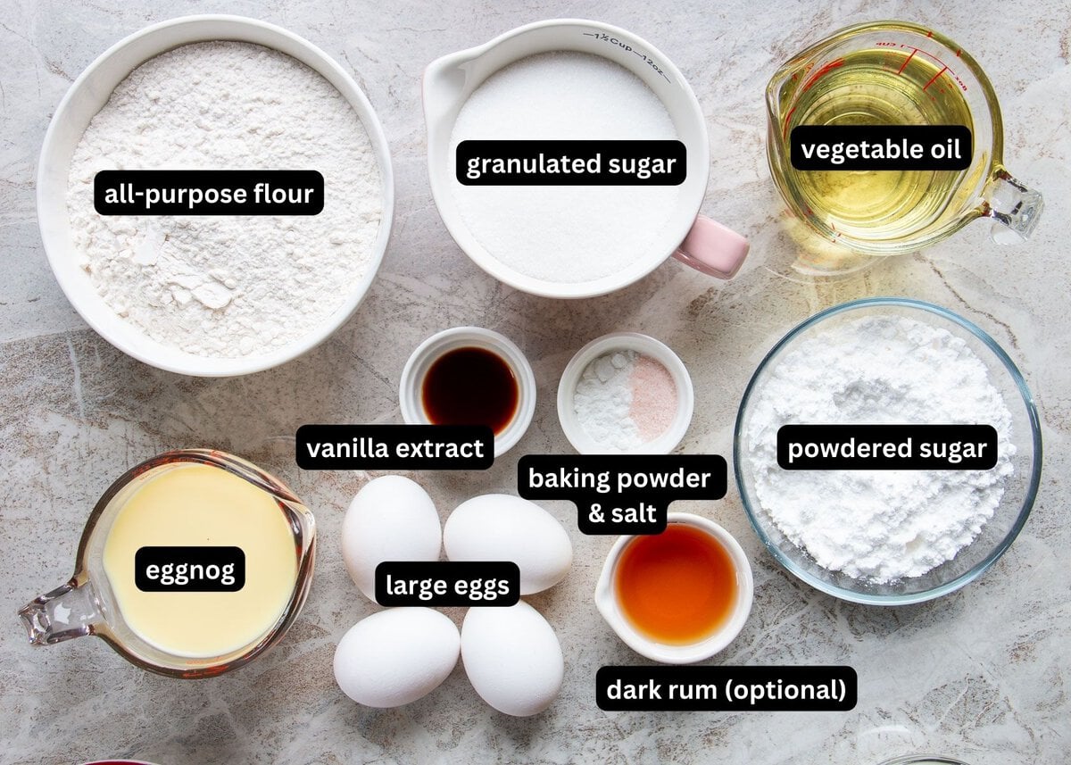 A labelled image of all ingredients needed to make eggnog cake with glaze.