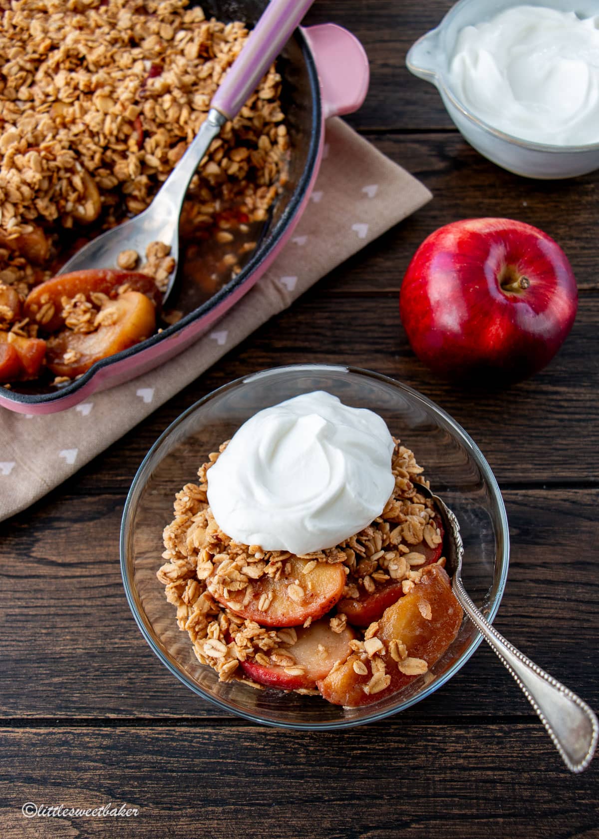 A bowl of stovetop apple crisp topped with Greek yogurt.