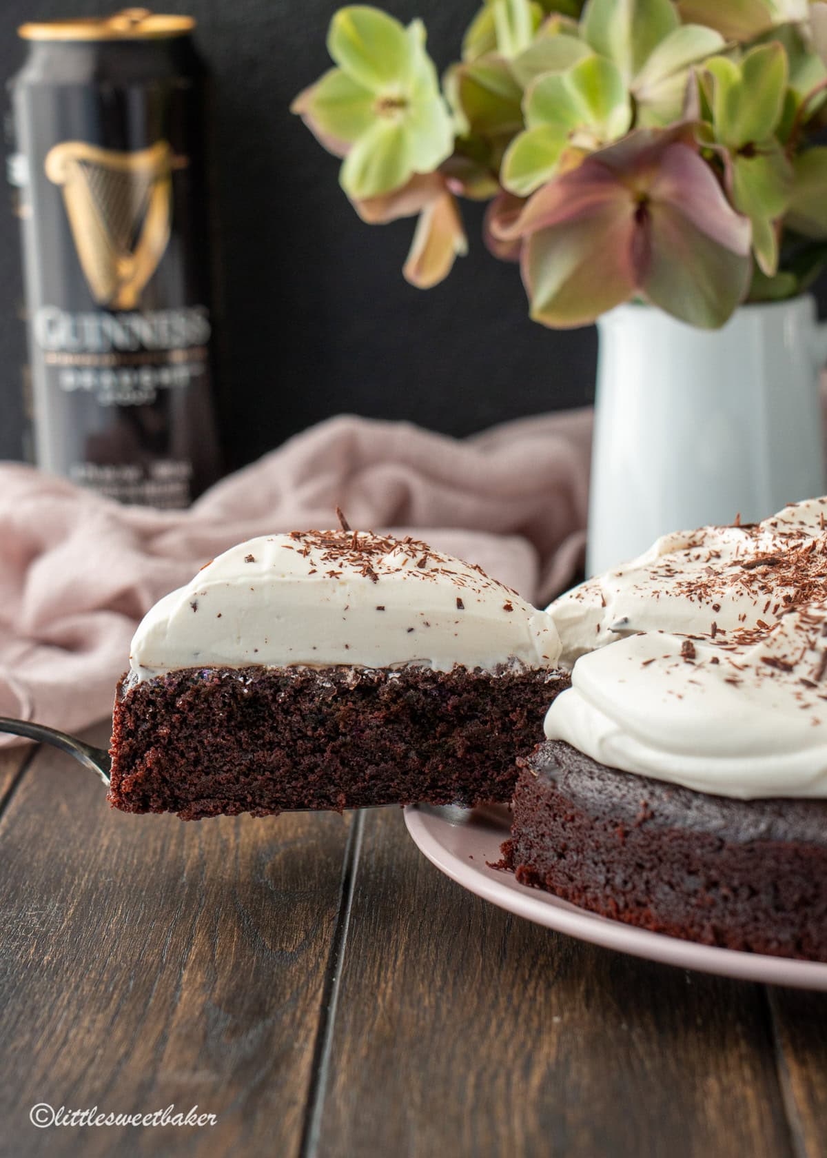 A slice of chocolate Guinness Cake being removed from the rest of the cake.