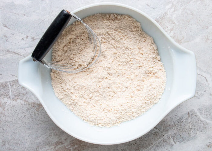 A bowl of flour mixture for Irish apple cake.