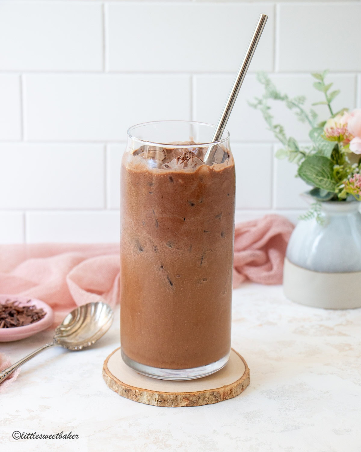 A glass of chocolate protein cold foam iced coffee.