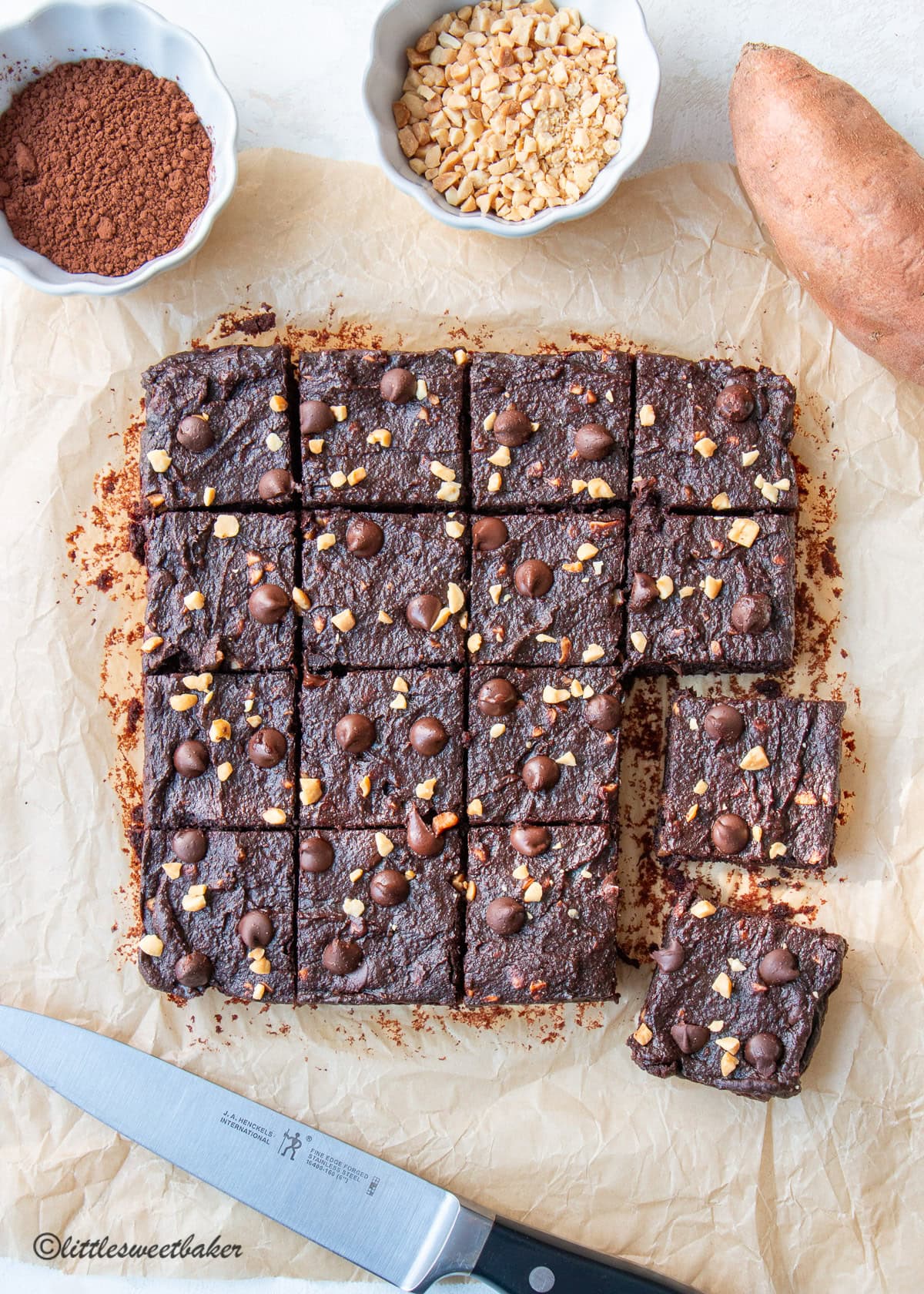Sweet Potato Brownies cut into squares on parchment paper.
