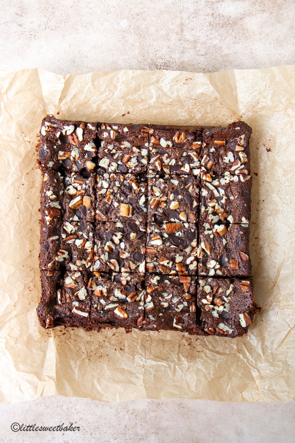 High-protein brownies cut into squares on parchment paper.