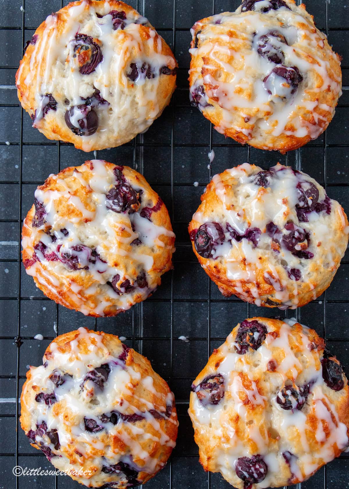 Healthy baked blueberry fritters on a cooling rack.