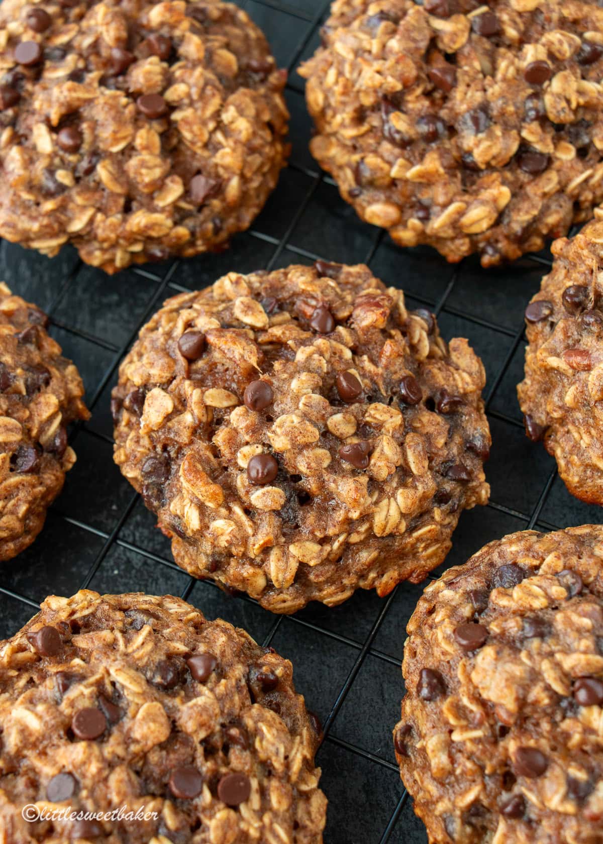 A close-up of healthy banana oatmeal cookies on a cooling rack.